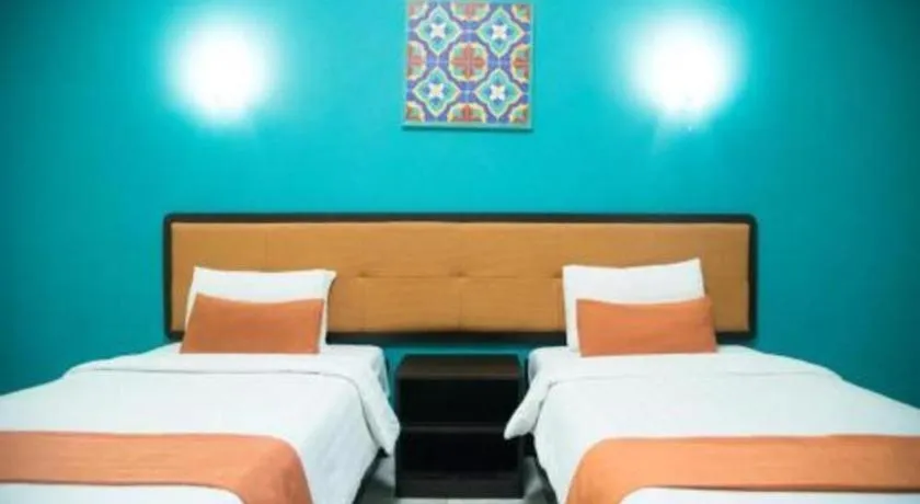 Bed in Ole Suite Hotel