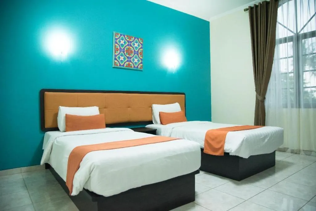 Bed in Ole Suite Hotel