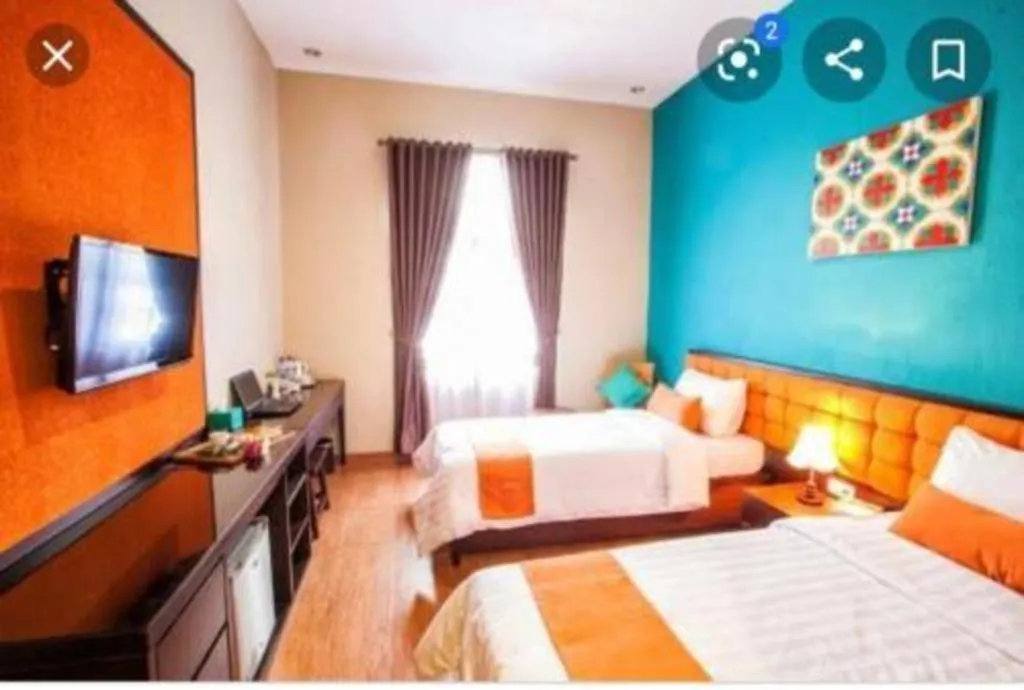 Bed in Ole Suite Hotel