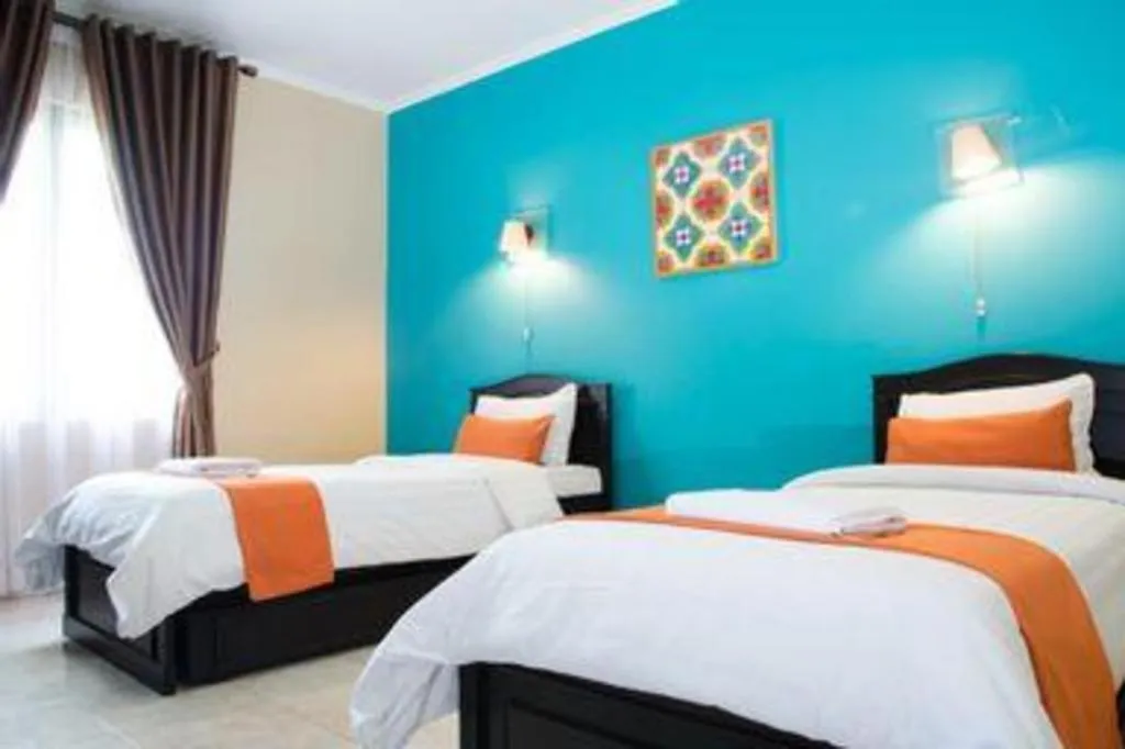 Bed in Ole Suite Hotel