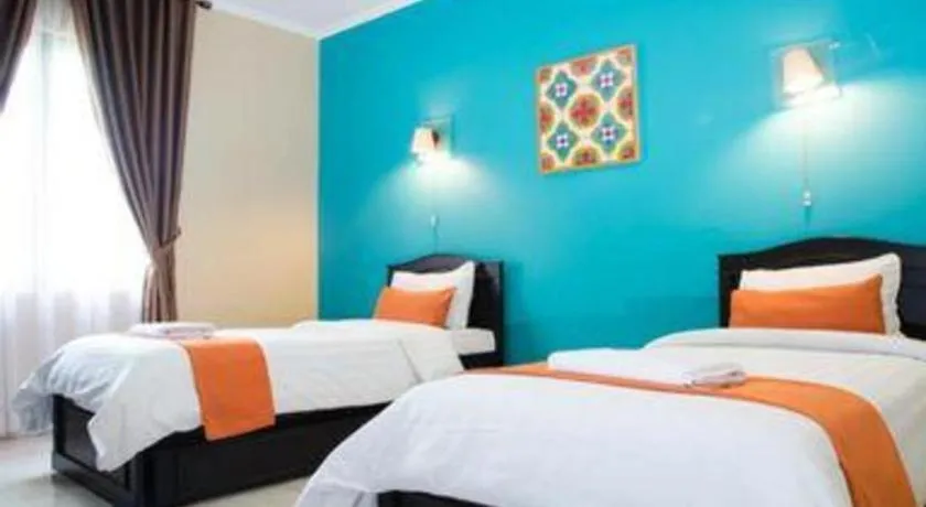 Bed in Ole Suite Hotel