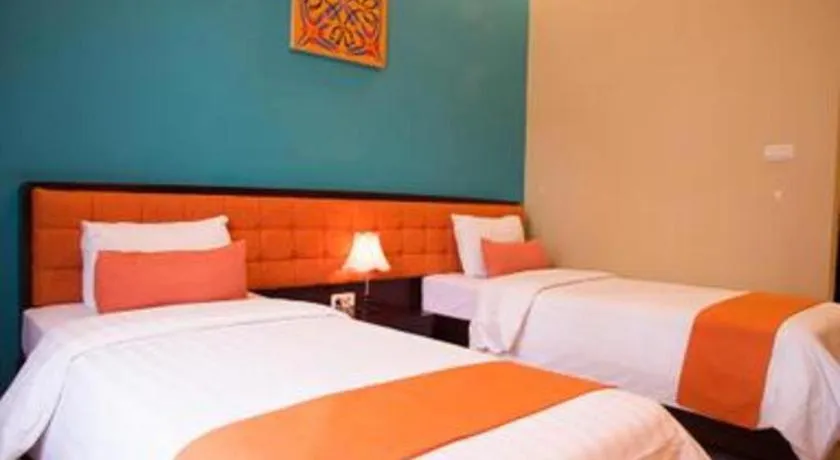 Bed in Ole Suite Hotel