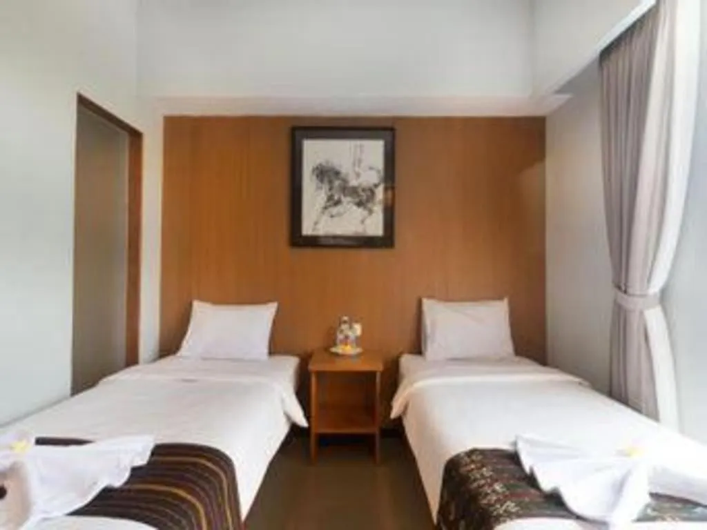 Bed in Hadi Poetra Hotel