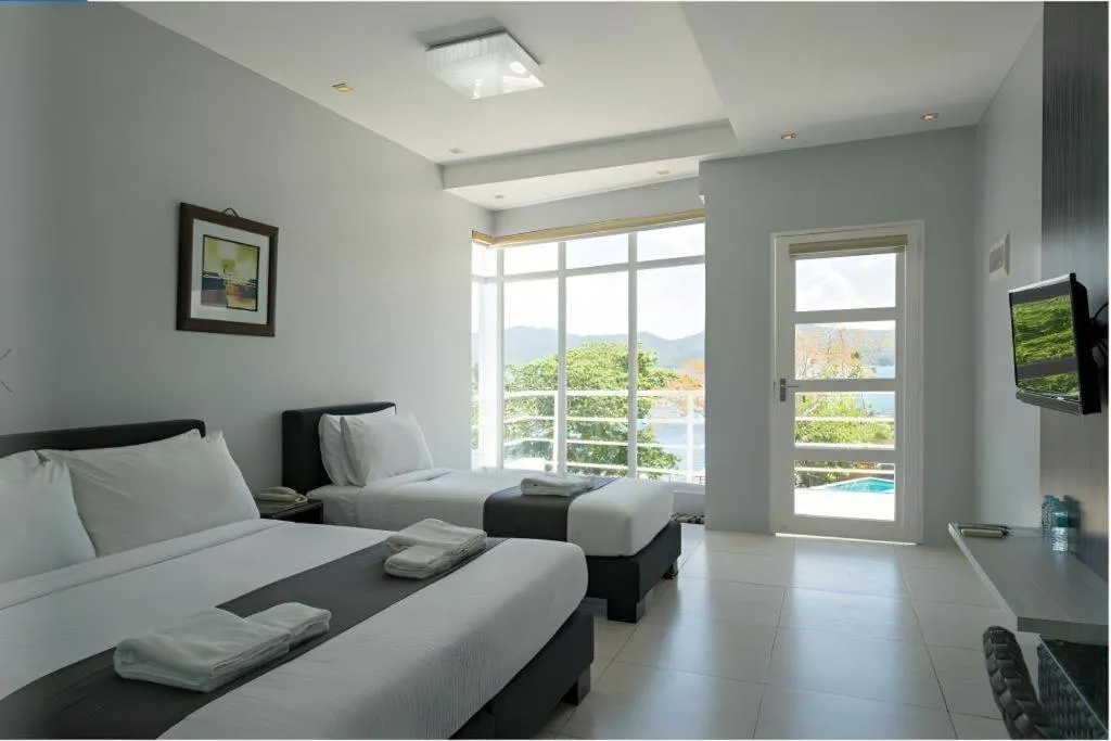 Bed in Anilao Awari Bay Resort