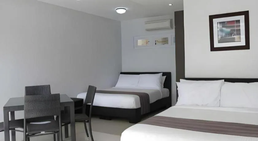 Bed in Anilao Awari Bay Resort