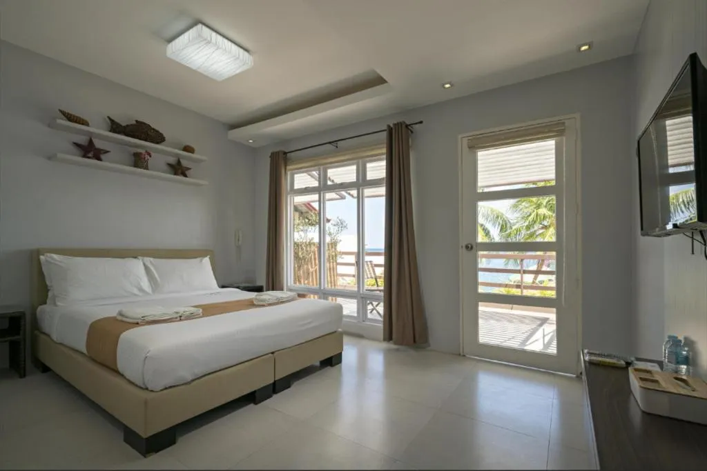 Bed in Anilao Awari Bay Resort