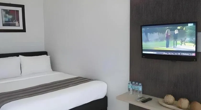 Bed in Anilao Awari Bay Resort