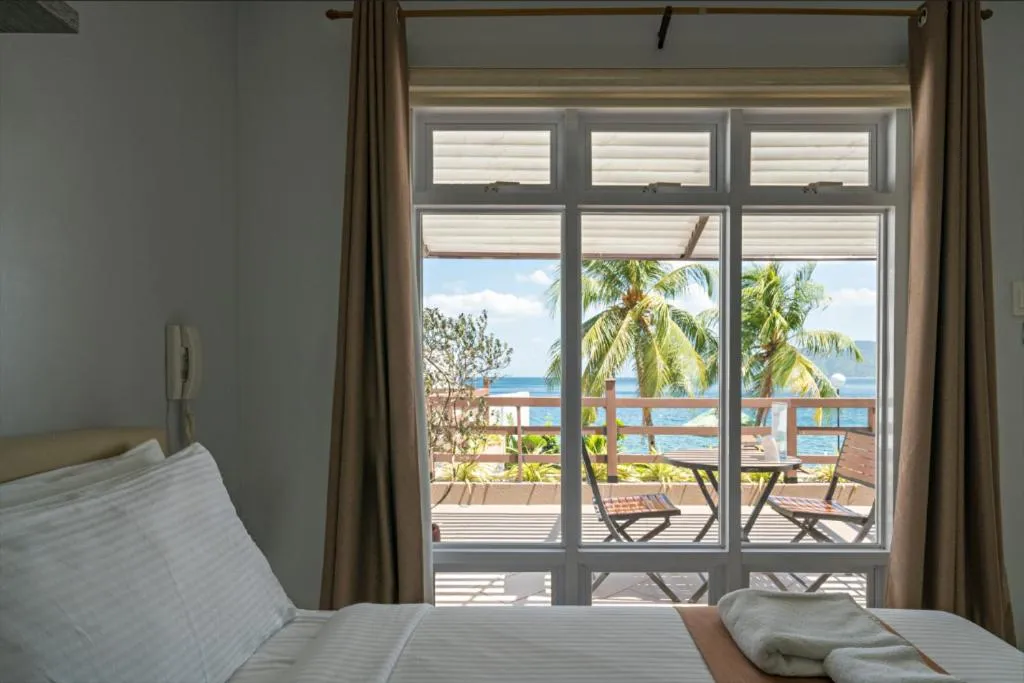 Bed in Anilao Awari Bay Resort