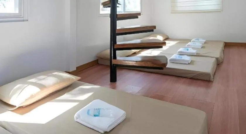 Bed in Anilao Awari Bay Resort