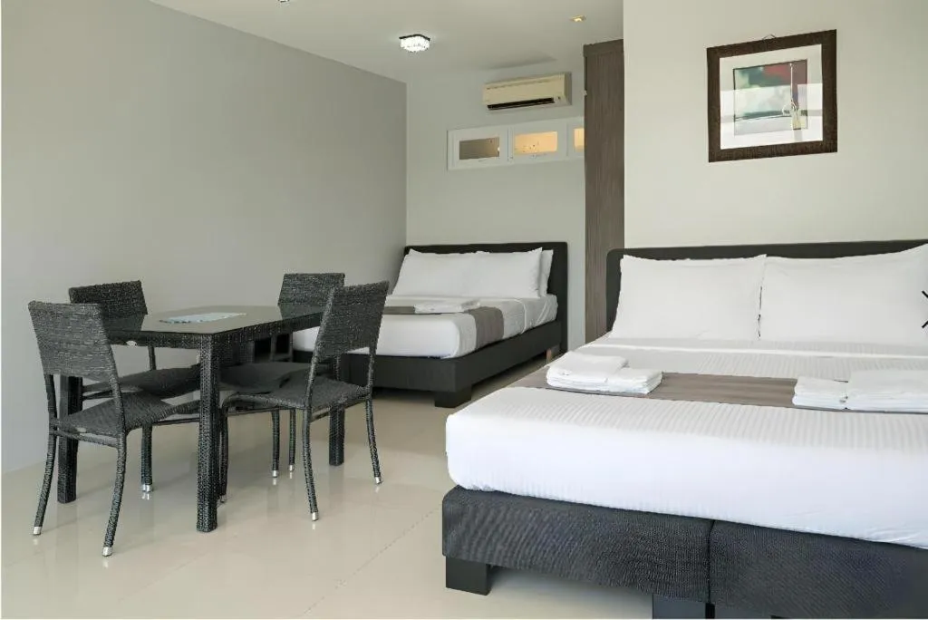 Bed in Anilao Awari Bay Resort