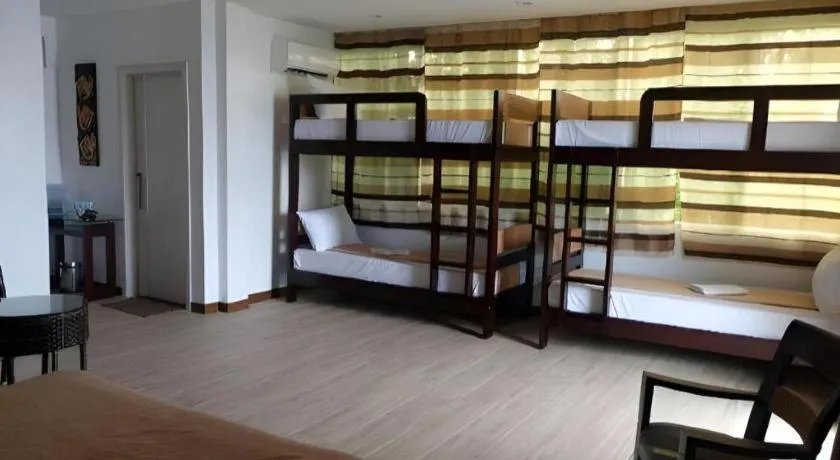 Bed in Anilao Awari Bay Resort