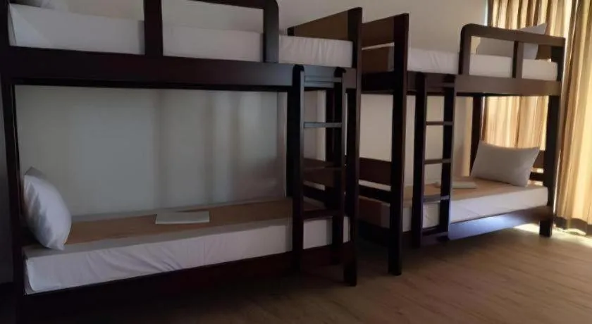 Bed in Anilao Awari Bay Resort