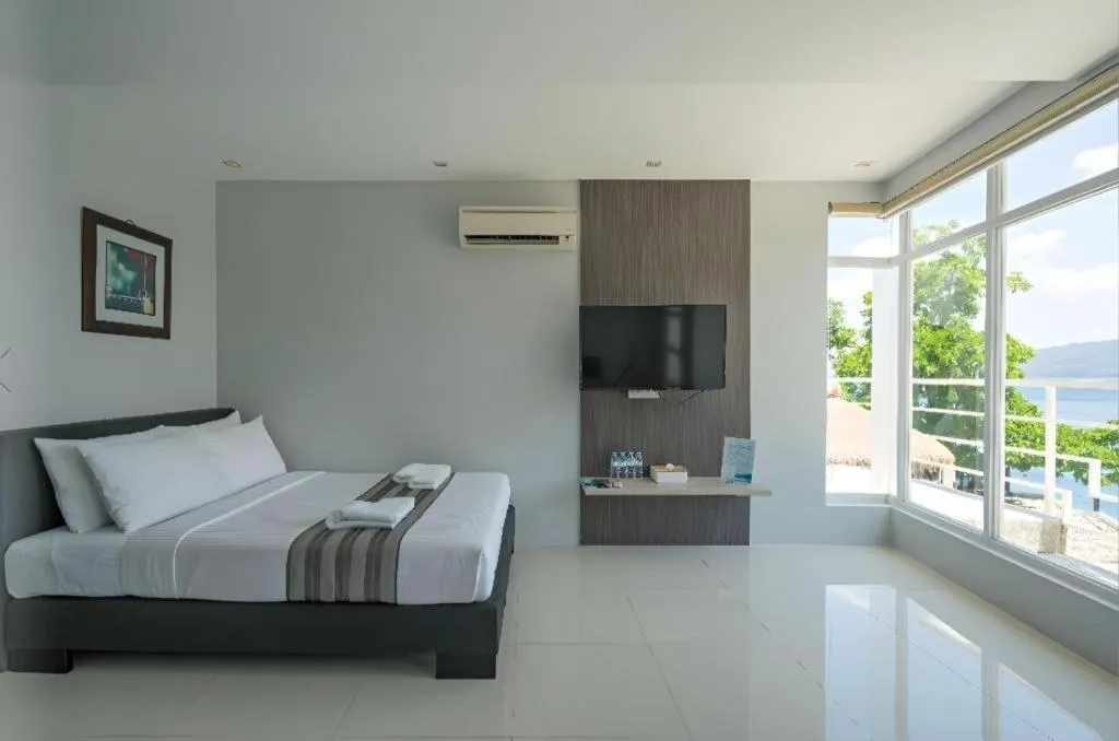 Bed in Anilao Awari Bay Resort