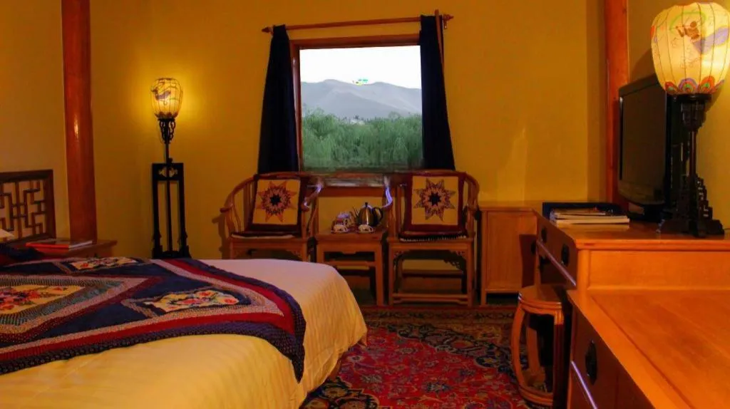 Bed in The Silk Road Dunhuang Hotel