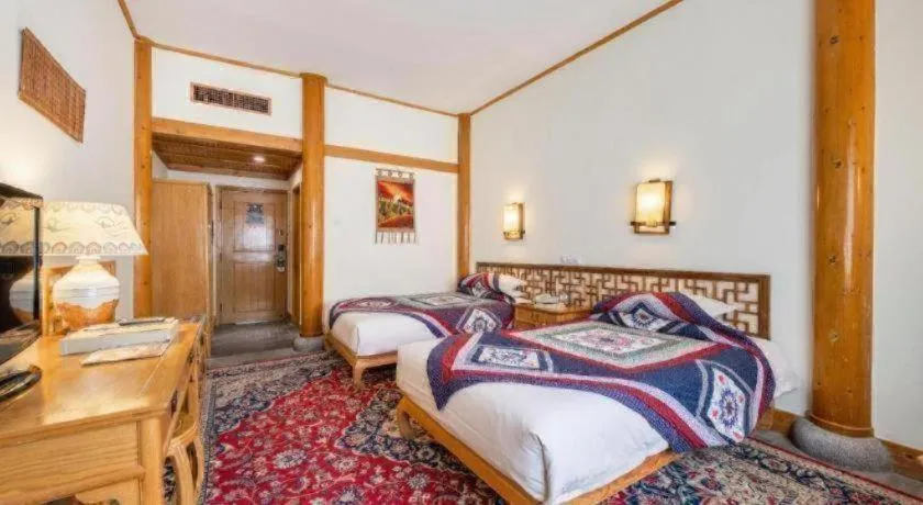 Bed in The Silk Road Dunhuang Hotel