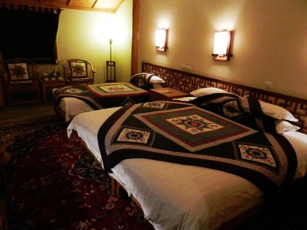 Bed in The Silk Road Dunhuang Hotel