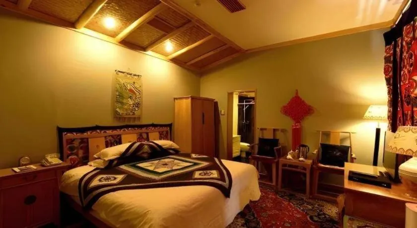 Bed in The Silk Road Dunhuang Hotel