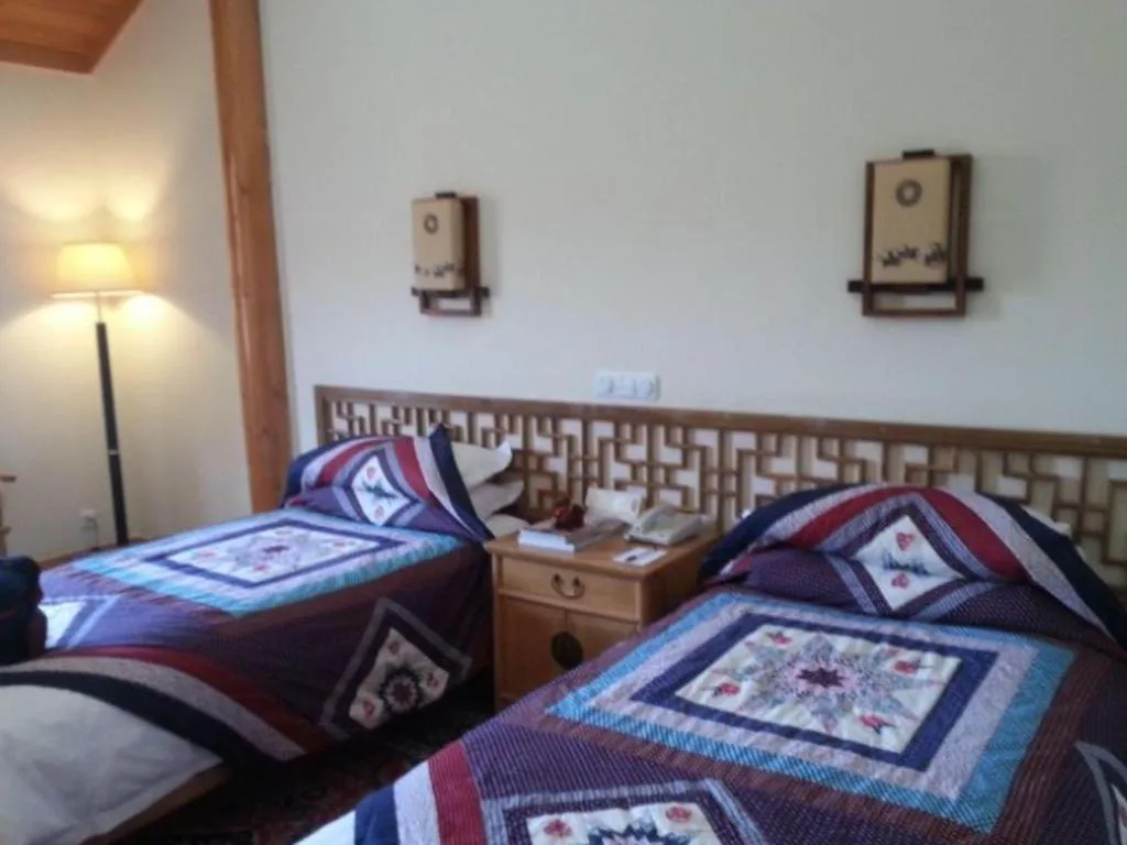 Bed in The Silk Road Dunhuang Hotel