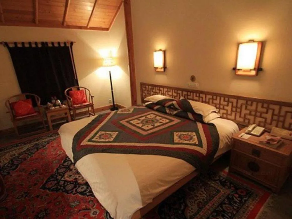 Bed in The Silk Road Dunhuang Hotel