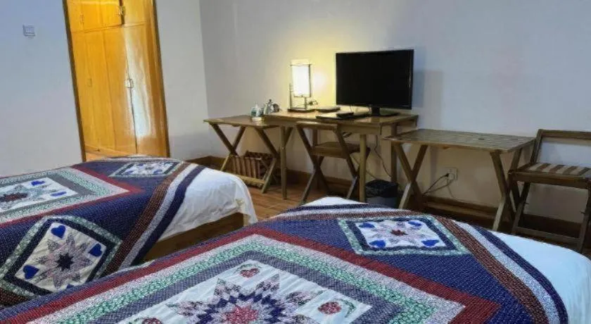 Bed in The Silk Road Dunhuang Hotel