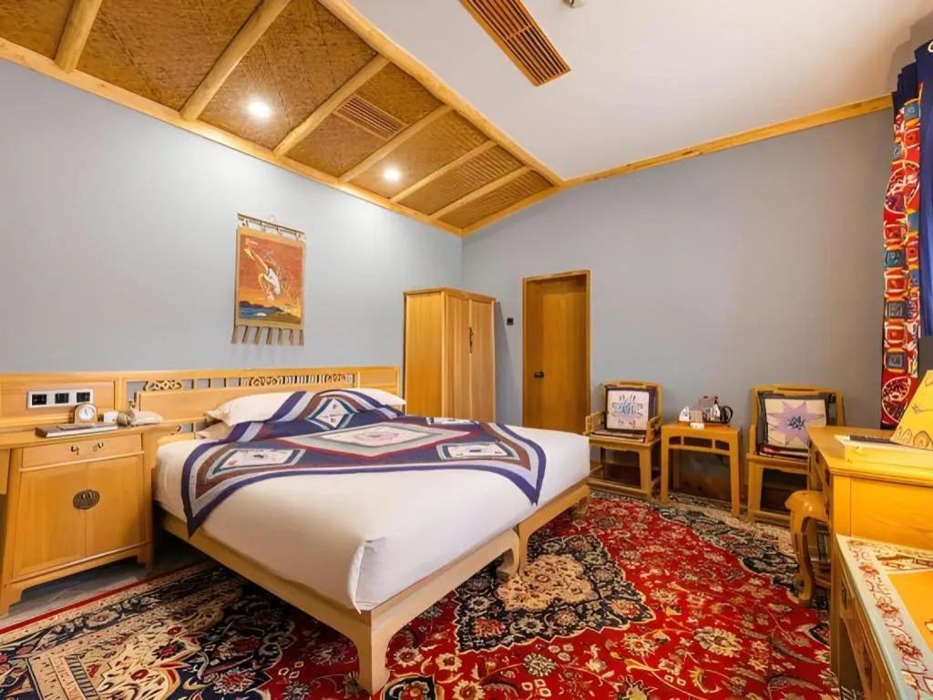 Bed in The Silk Road Dunhuang Hotel