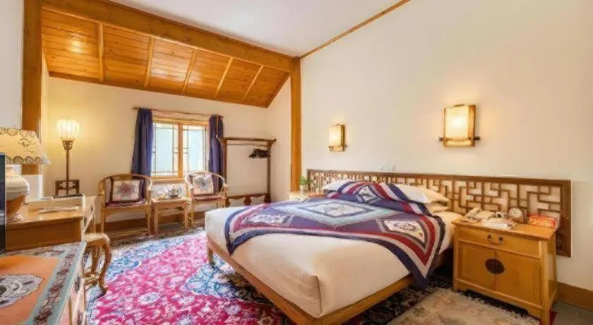 Bed in The Silk Road Dunhuang Hotel