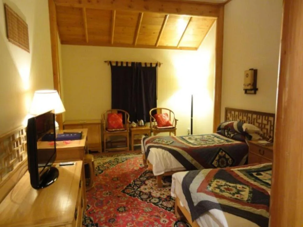 Bed in The Silk Road Dunhuang Hotel