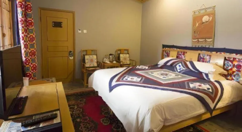 Bed in The Silk Road Dunhuang Hotel