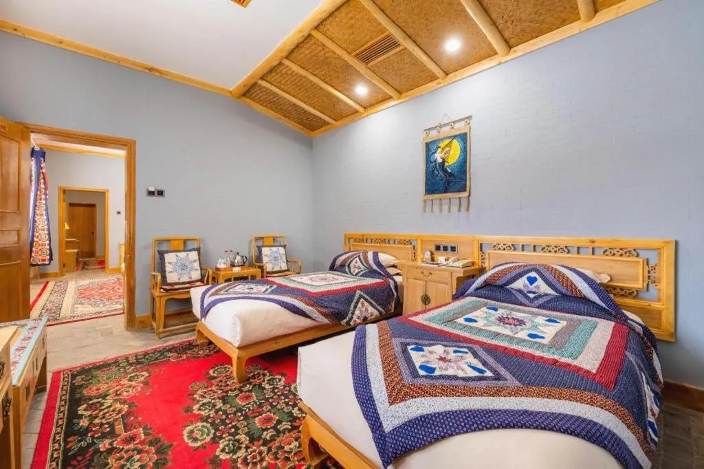 Bed in The Silk Road Dunhuang Hotel