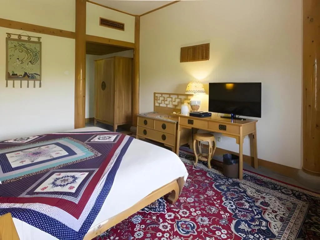 Bed in The Silk Road Dunhuang Hotel