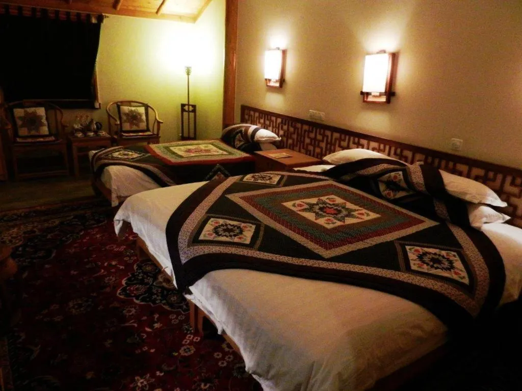 Bed in The Silk Road Dunhuang Hotel