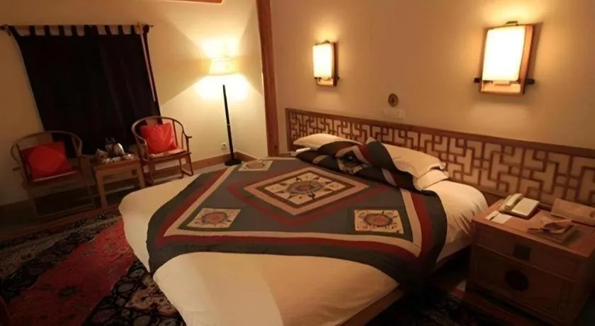 Bed in The Silk Road Dunhuang Hotel