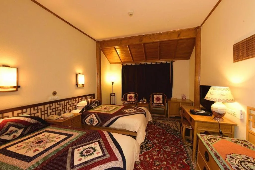 Bed in The Silk Road Dunhuang Hotel