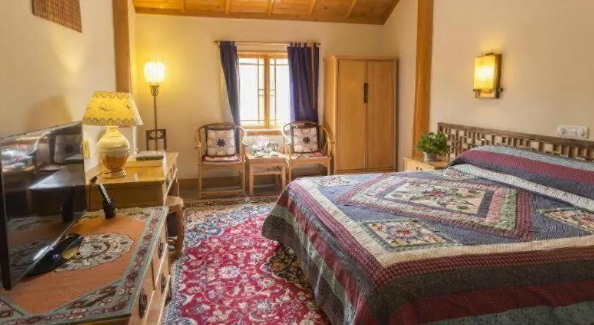 Bed in The Silk Road Dunhuang Hotel