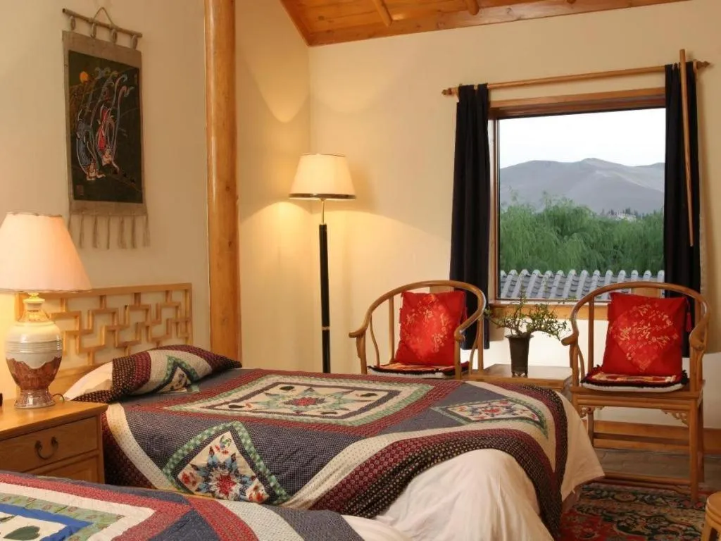 Bed in The Silk Road Dunhuang Hotel