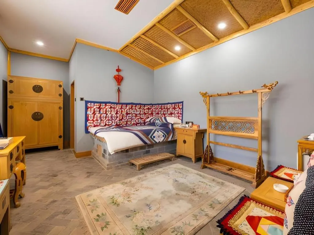 Bed in The Silk Road Dunhuang Hotel