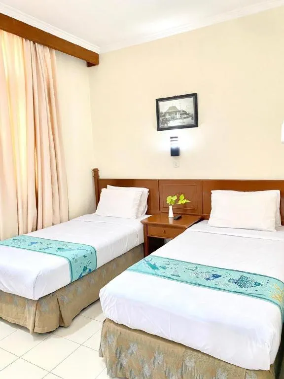 Bed in Hotel Griyadi Kusuma Sahid