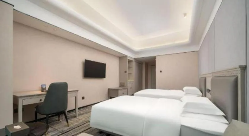 Bed in Zhuhai Dehan Hotel