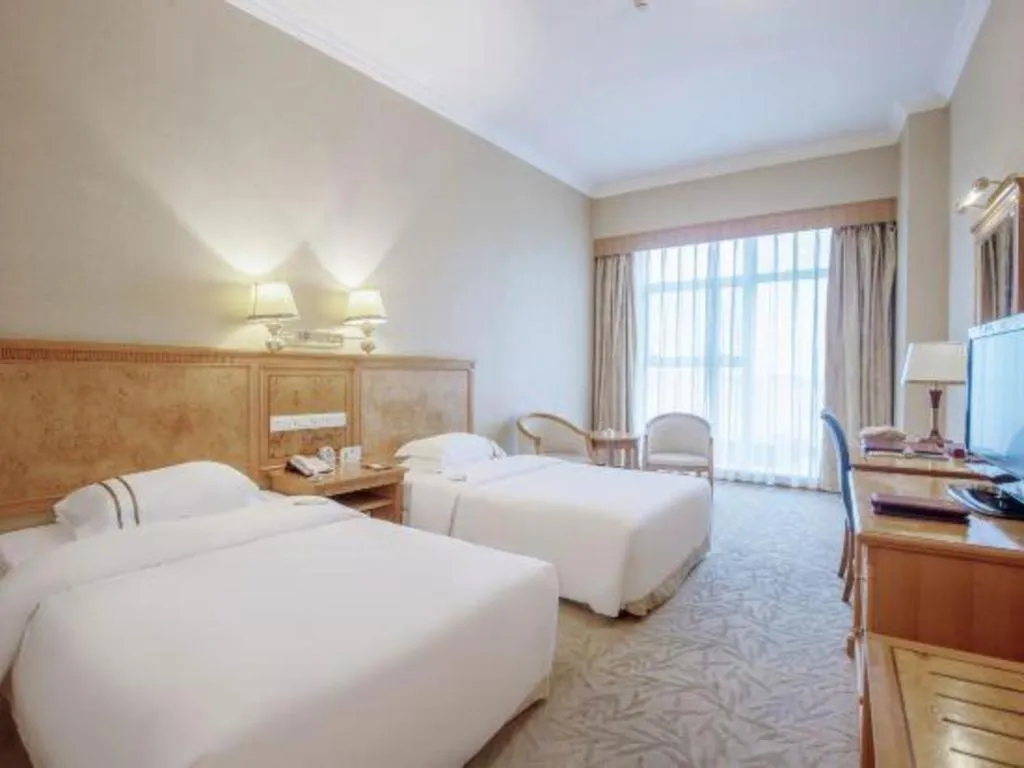 Bed in Zhuhai Dehan Hotel