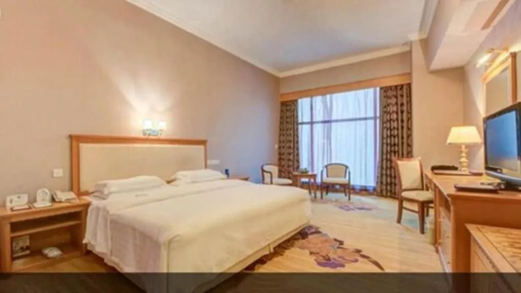 Bed in Zhuhai Dehan Hotel