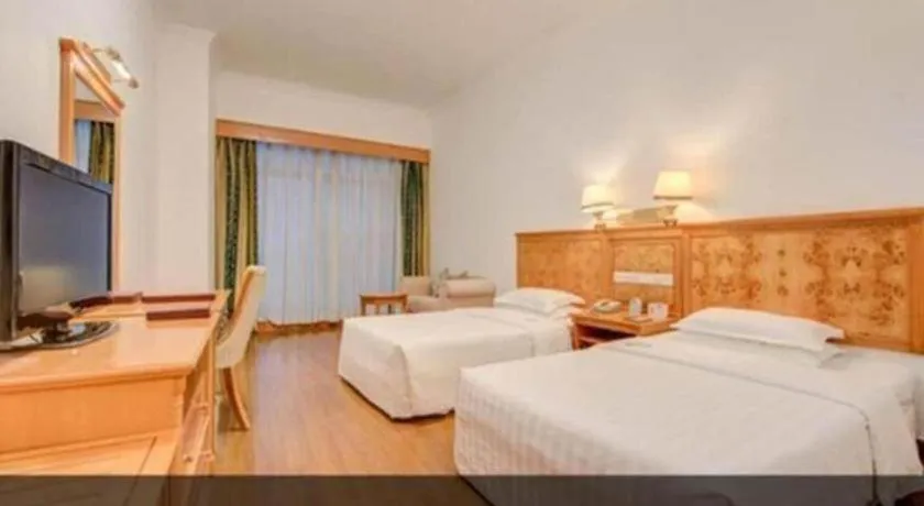 Bed in Zhuhai Dehan Hotel