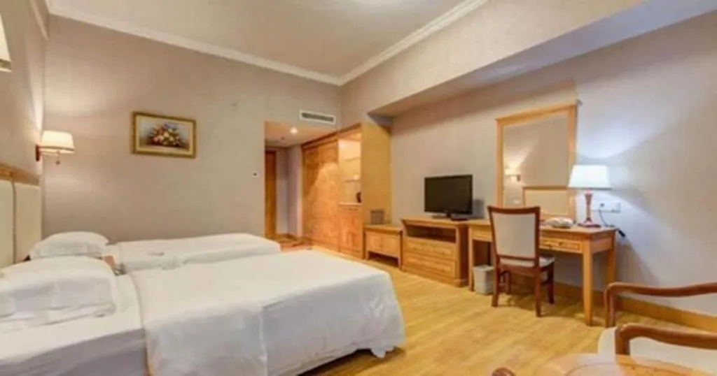 Bed in Zhuhai Dehan Hotel