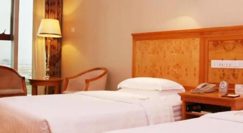 Bed in Zhuhai Dehan Hotel