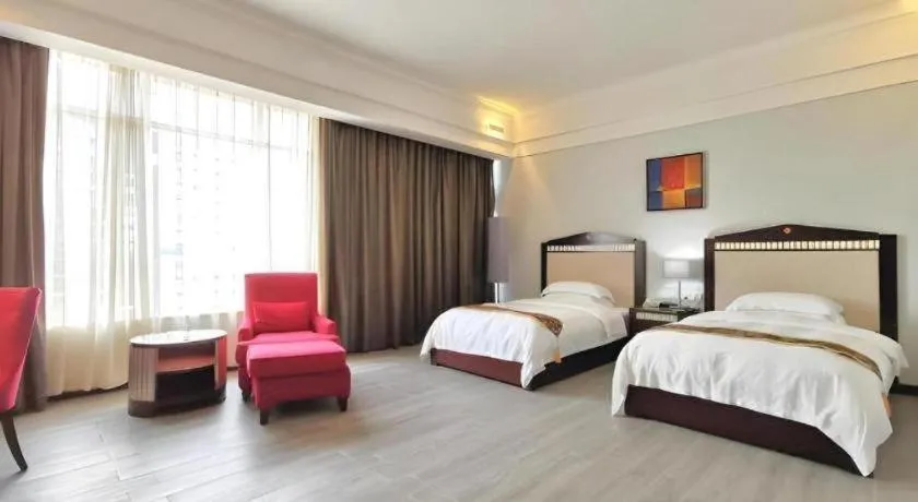 Bed in Hua Xia Pearl Hotel