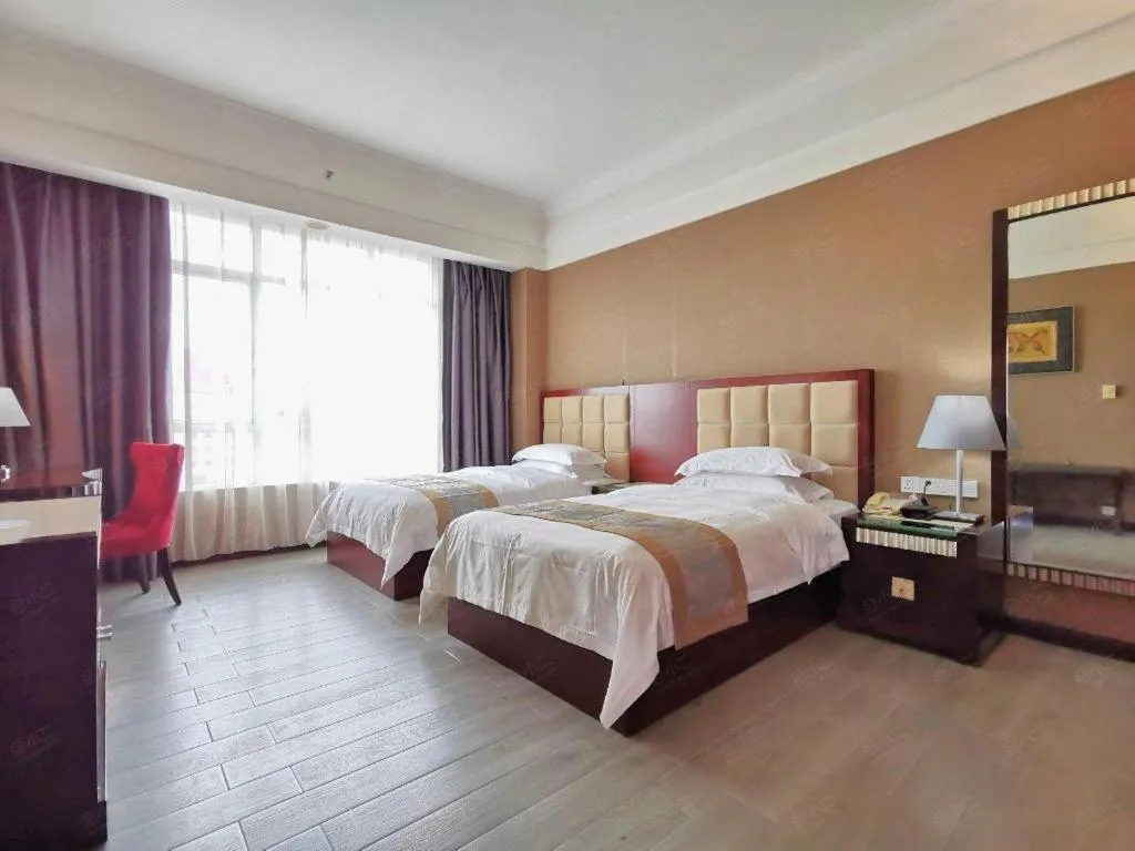 Bed in Hua Xia Pearl Hotel