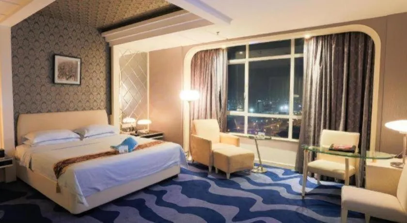 Bed in Hua Xia Pearl Hotel