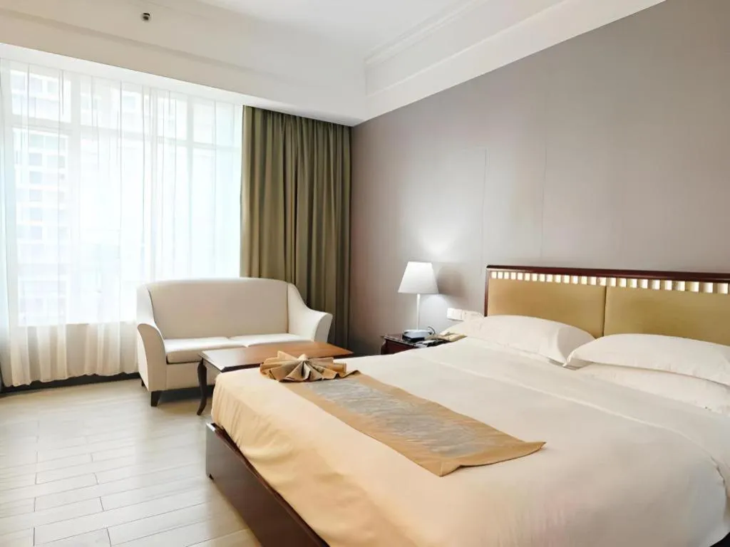 Bed in Hua Xia Pearl Hotel