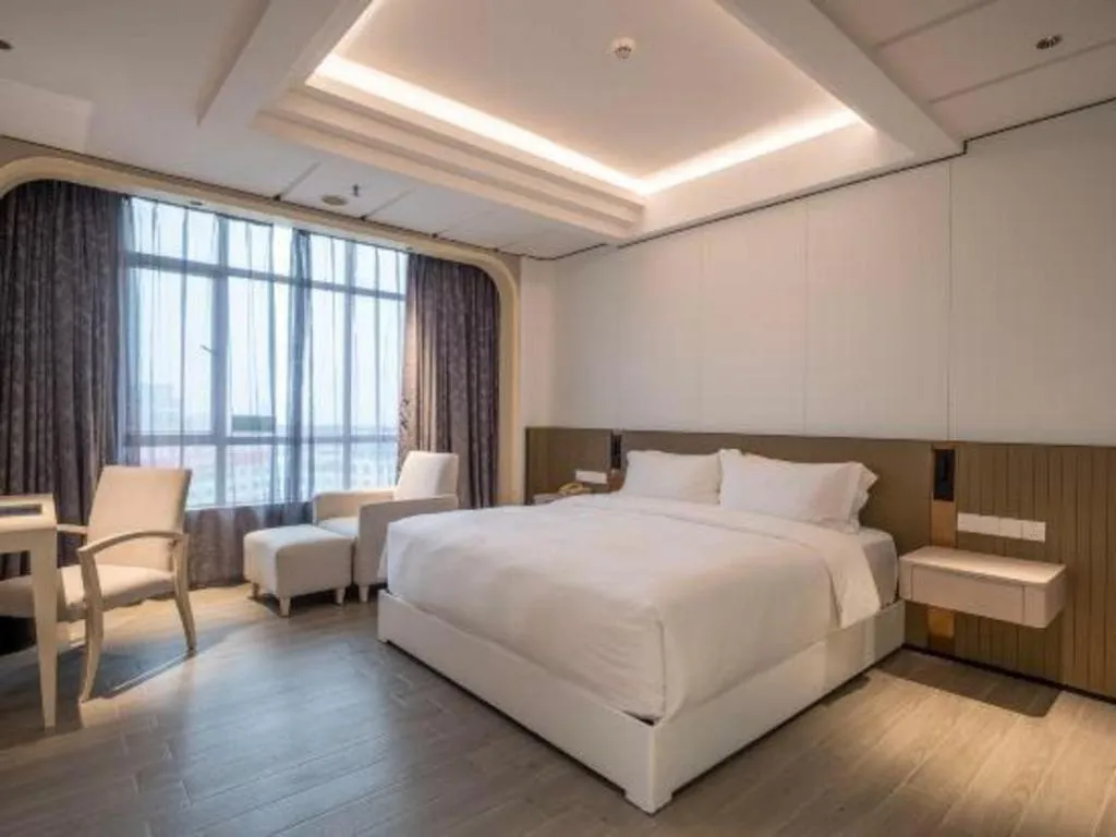 Bed in Hua Xia Pearl Hotel