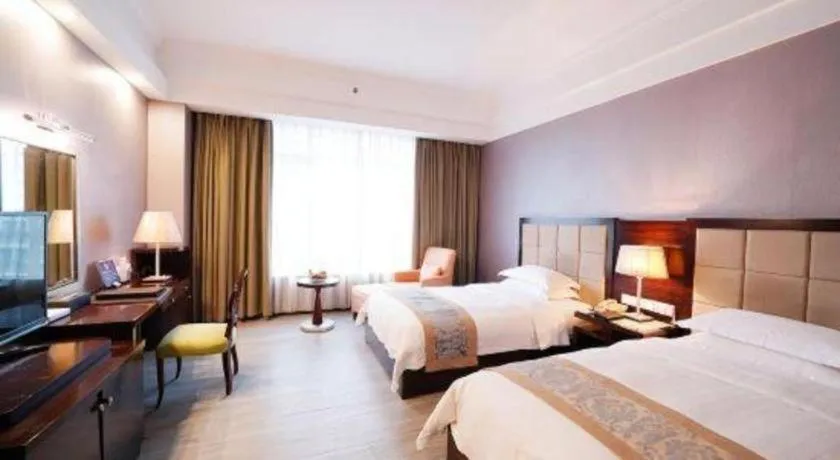 Bed in Hua Xia Pearl Hotel