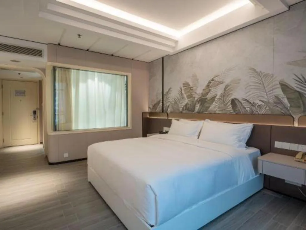 Bed in Hua Xia Pearl Hotel